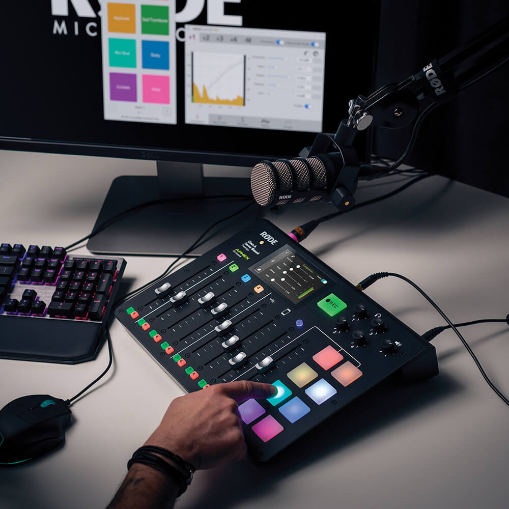 PodMic connected to RØDECaster Pro with finger pressing sound pad