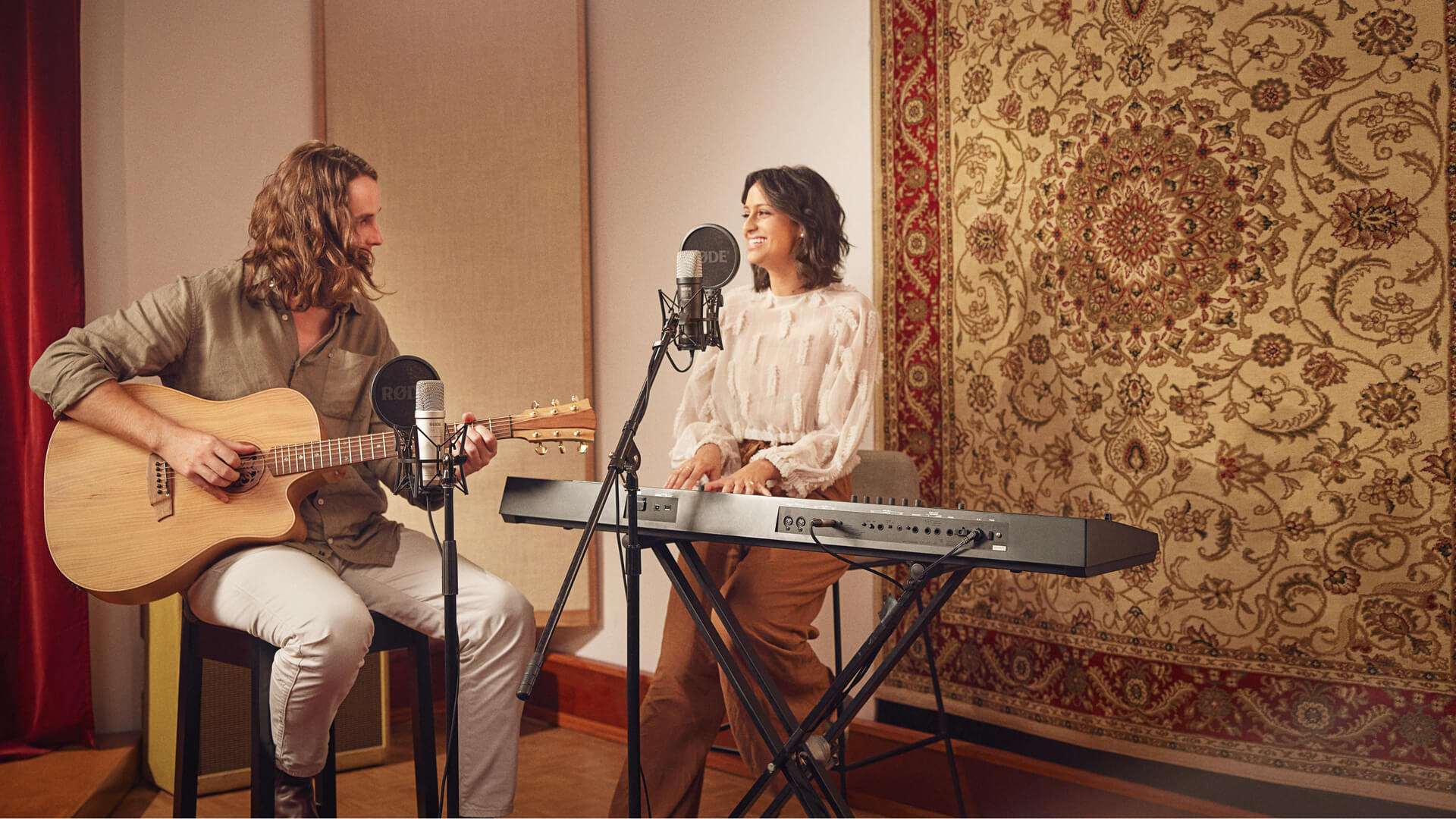 Musicians playing guitar and keyboard and singing with NT1 5th Generation