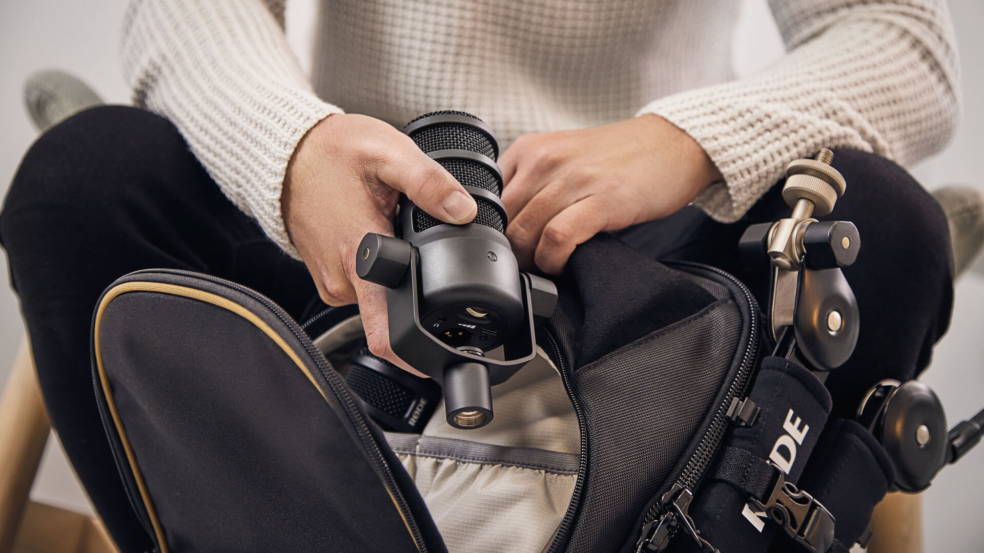 PodMic USB being placed into Backpack