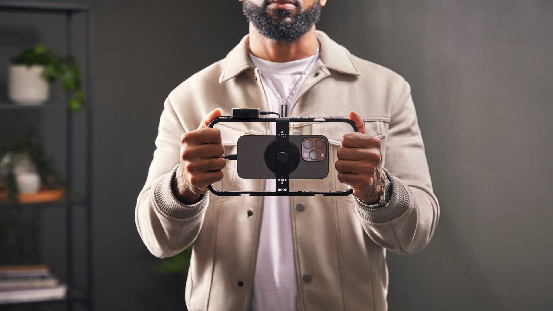 Man holding Phone Cage