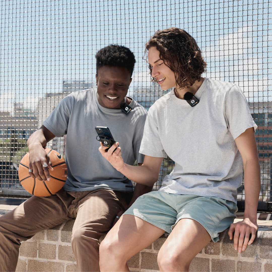 Basketball players reviewing footage recorded with Wireless ME Dual